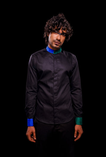 Front view of a black shirt with pintuck color block collar and cuff.