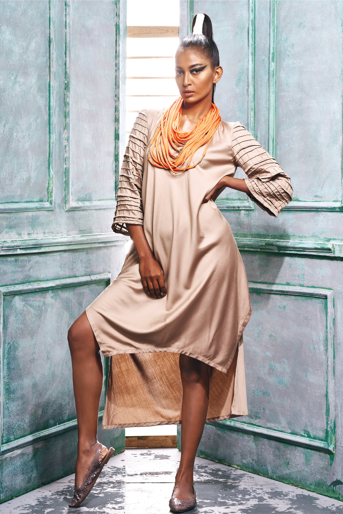 Front view of an asymmetric hem kurta style dress.