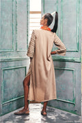 Back view of an asymmetric hem kurta style dress.