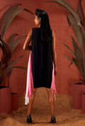Back view of a black asymmetric sleeveless dress.
