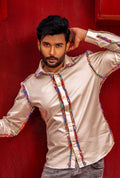 Front view of a beige shirt with fray detail on seams.
