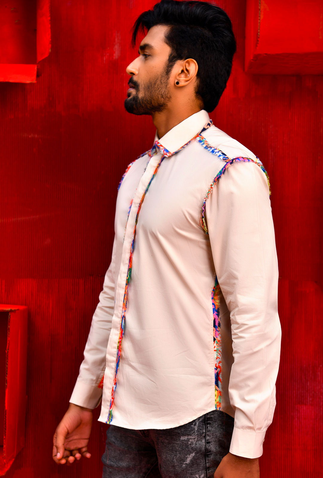 Front view of a beige shirt with fray detail on seams.