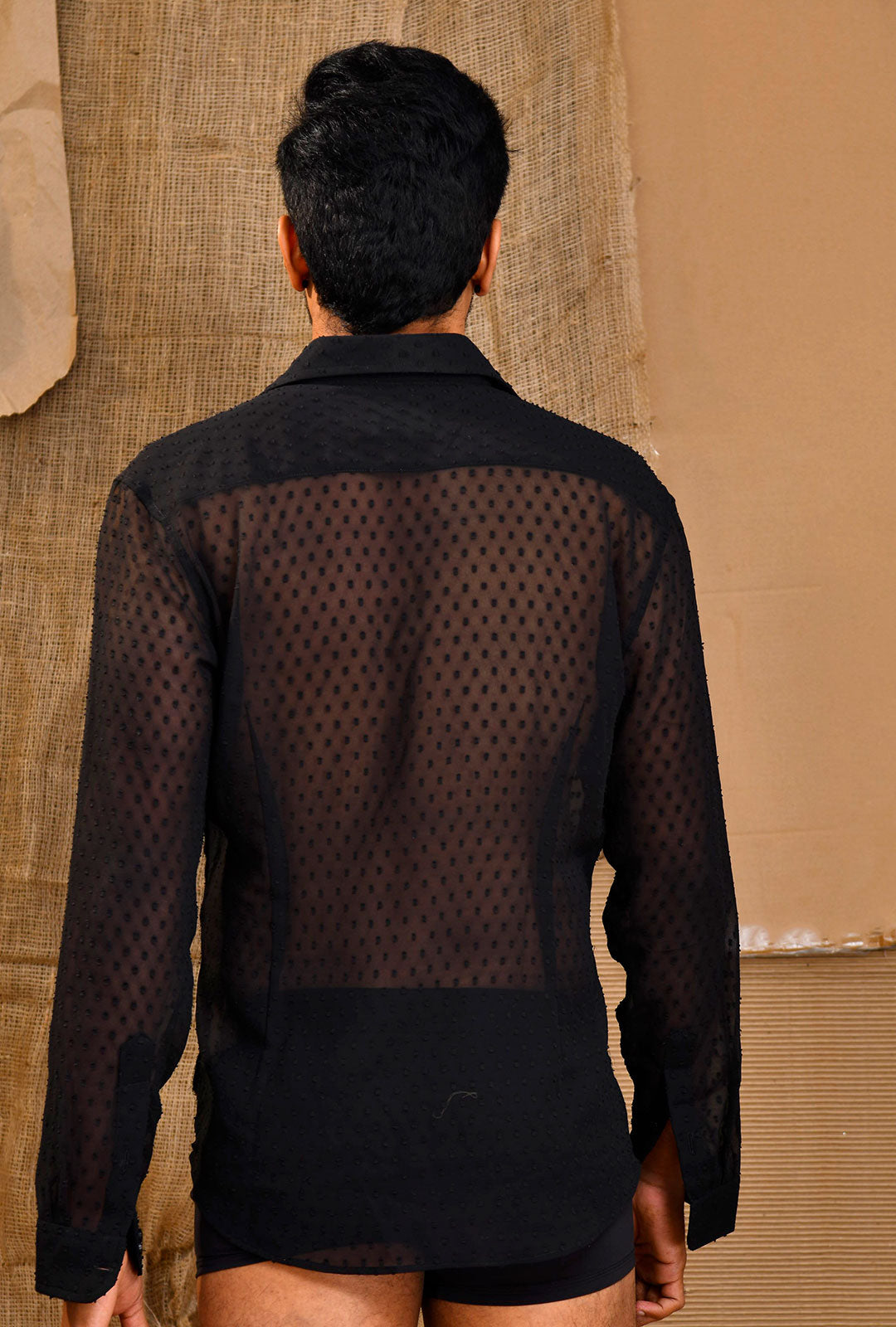 Front view of a paneled brasso shirt in black.