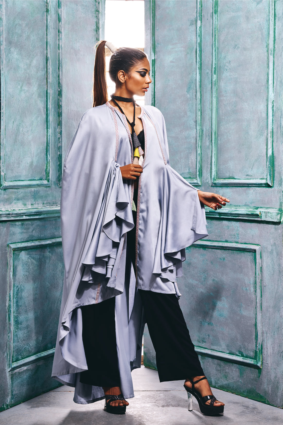 Cape wrap with cascade sleeves.
