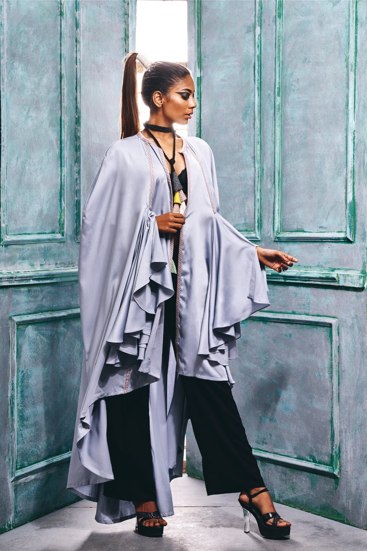 Cape wrap with cascade sleeves.