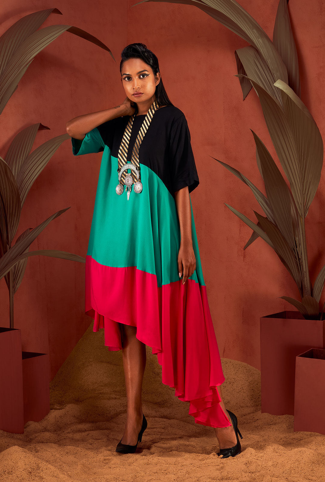 Front view of a sea green colour-blocked dress.
