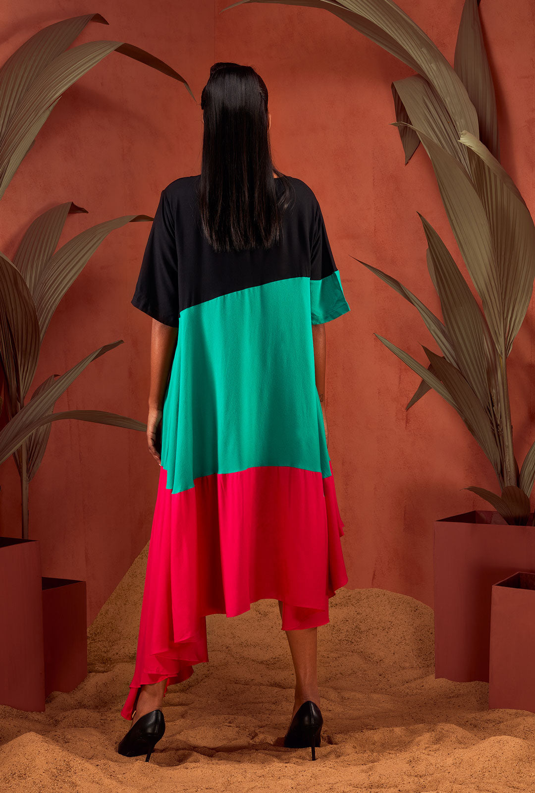 Front view of a sea green colour-blocked dress.
