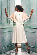 Back view of the dress with multi-color cascade sleeves.
