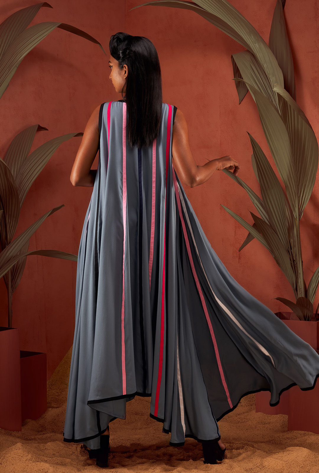 Front view of a grey color paneled multi-hue strip sleeveless dress.
