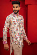 A printed asymmetrical shirt with frayed collar & cuff.