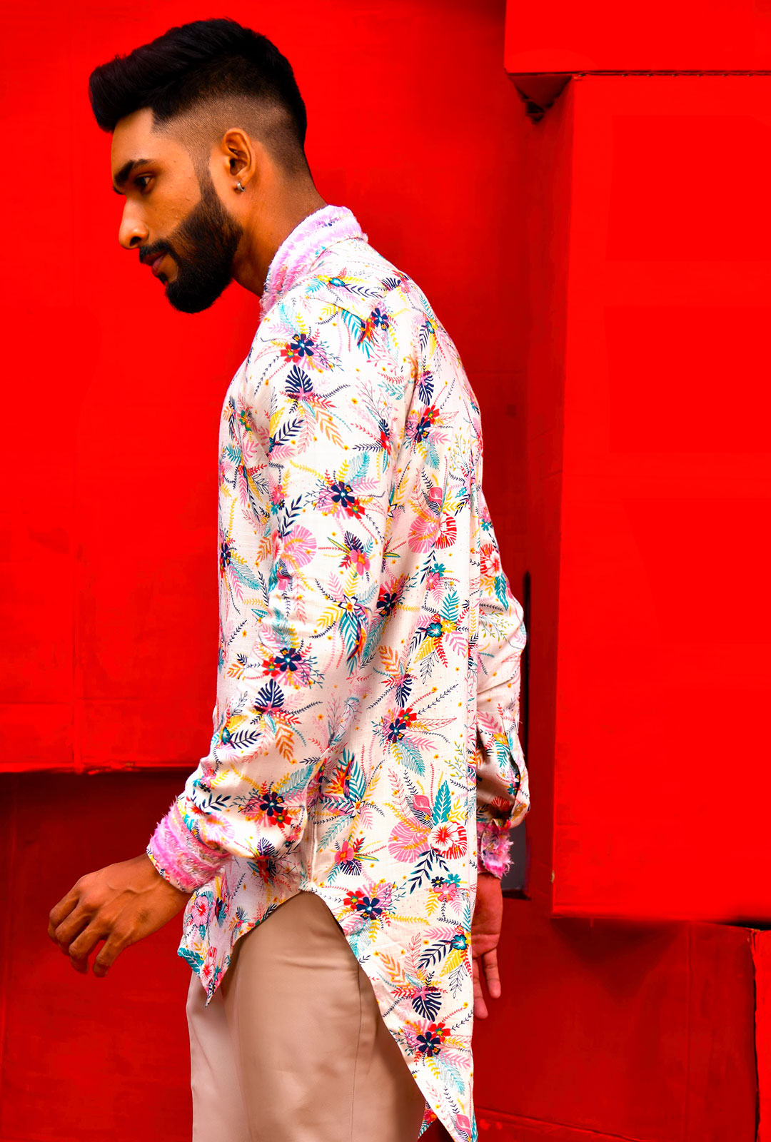 A printed asymmetrical shirt with frayed collar & cuff.