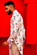 Side view of a printed asymmetrical shirt with frayed collar & cuff.