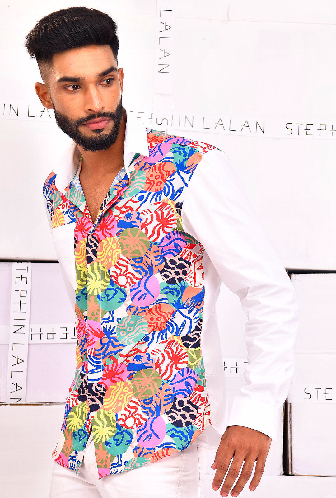 Front view of a white shirt with printed detailing.