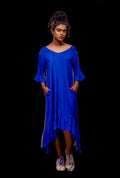 A model wearing a blue color reversible asymmetric dress.