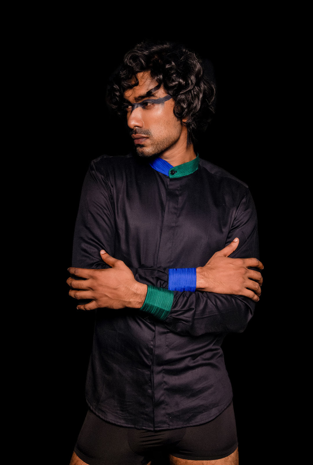 Front view of a black shirt with pintuck color block collar and cuff.