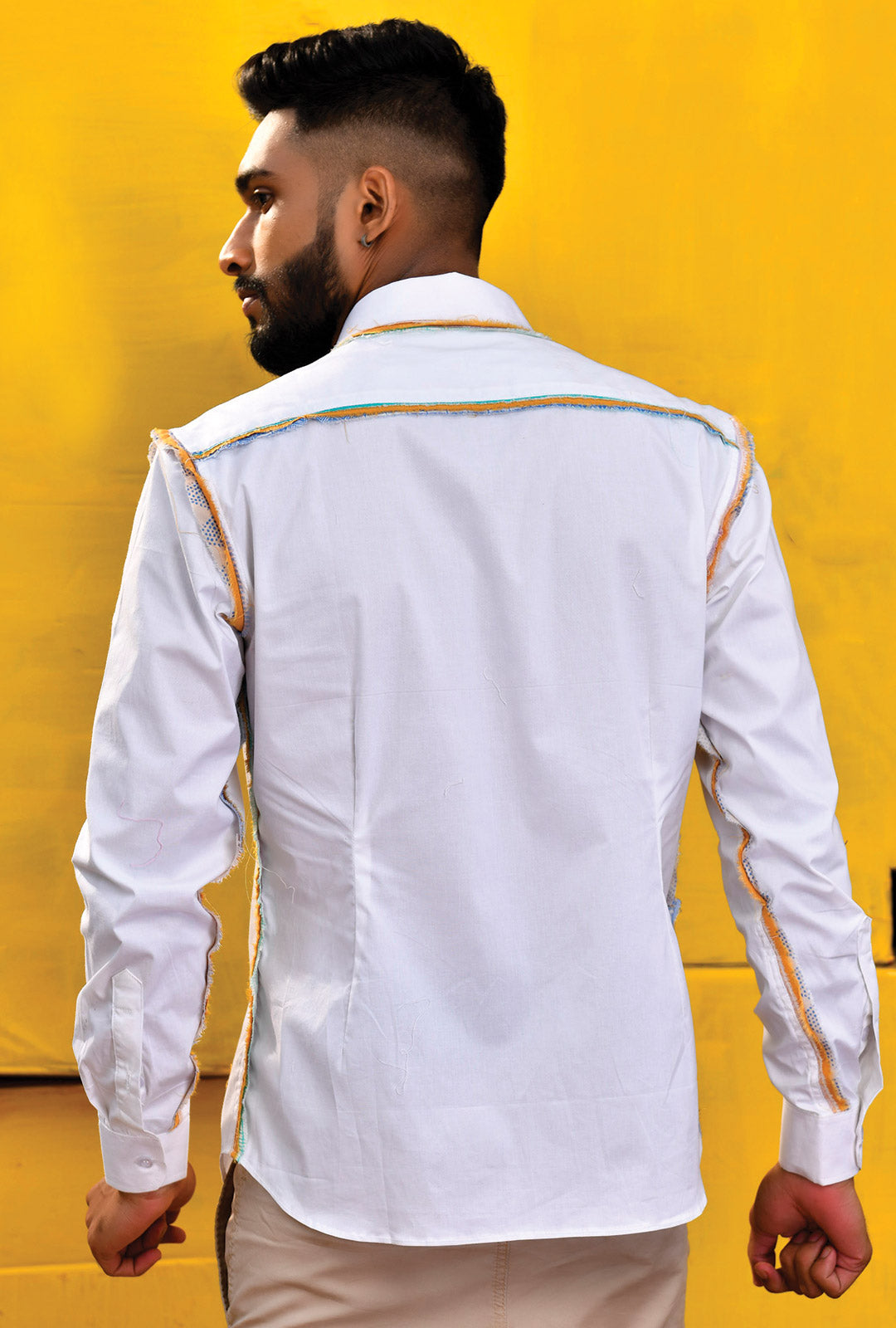 Front view of a white shirt with fray detail on seams.