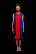 Front view of the Sleeveless color block pintuck dress with ruffle hem.