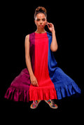 Stretched view of the Sleeveless color block pintuck dress with ruffle hem.