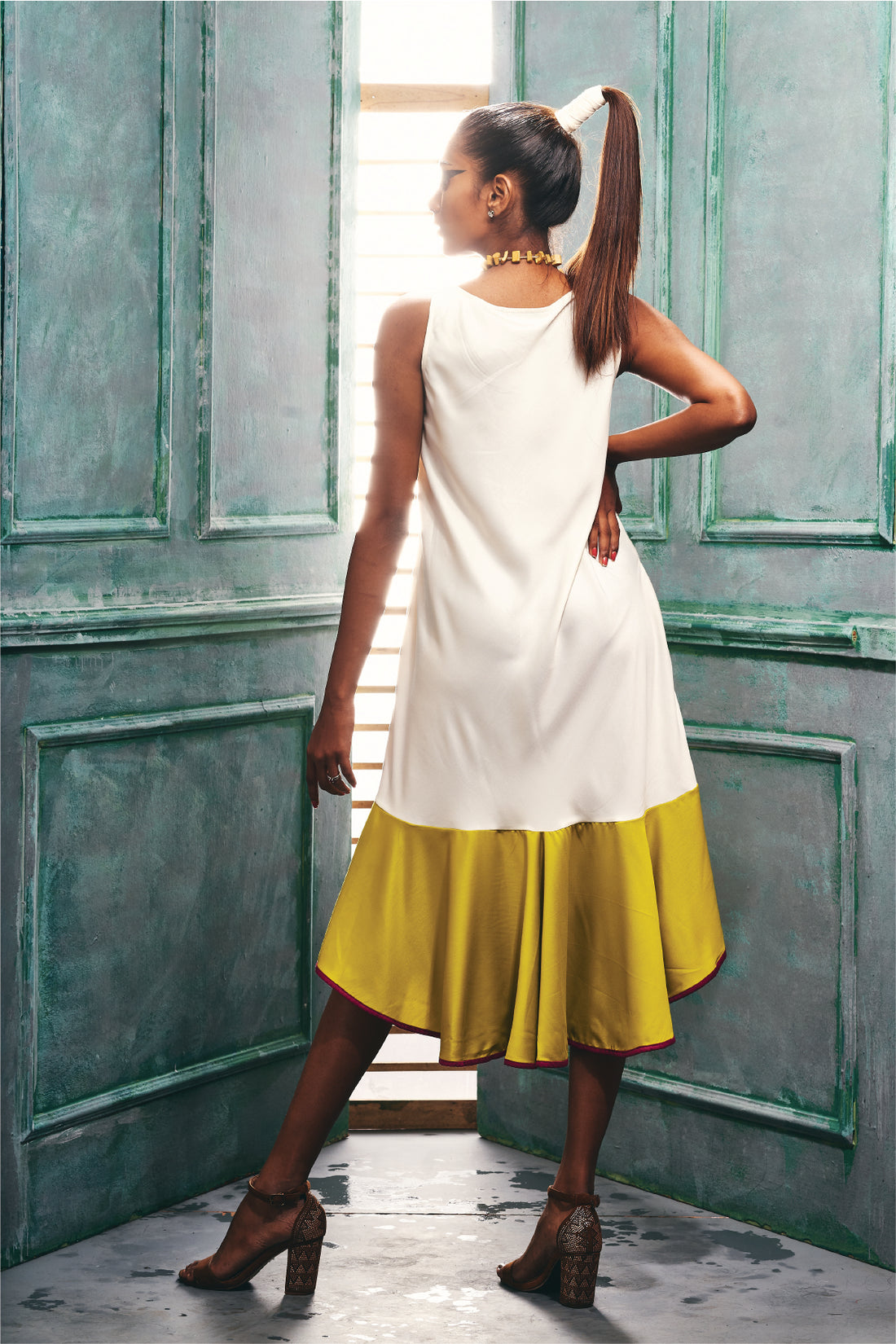 Front view of the Sleeveless Flapper Style Dress With a Flared Hem.