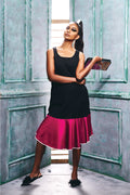 Front view of the sleeveless flapper style dress with a flared hem.