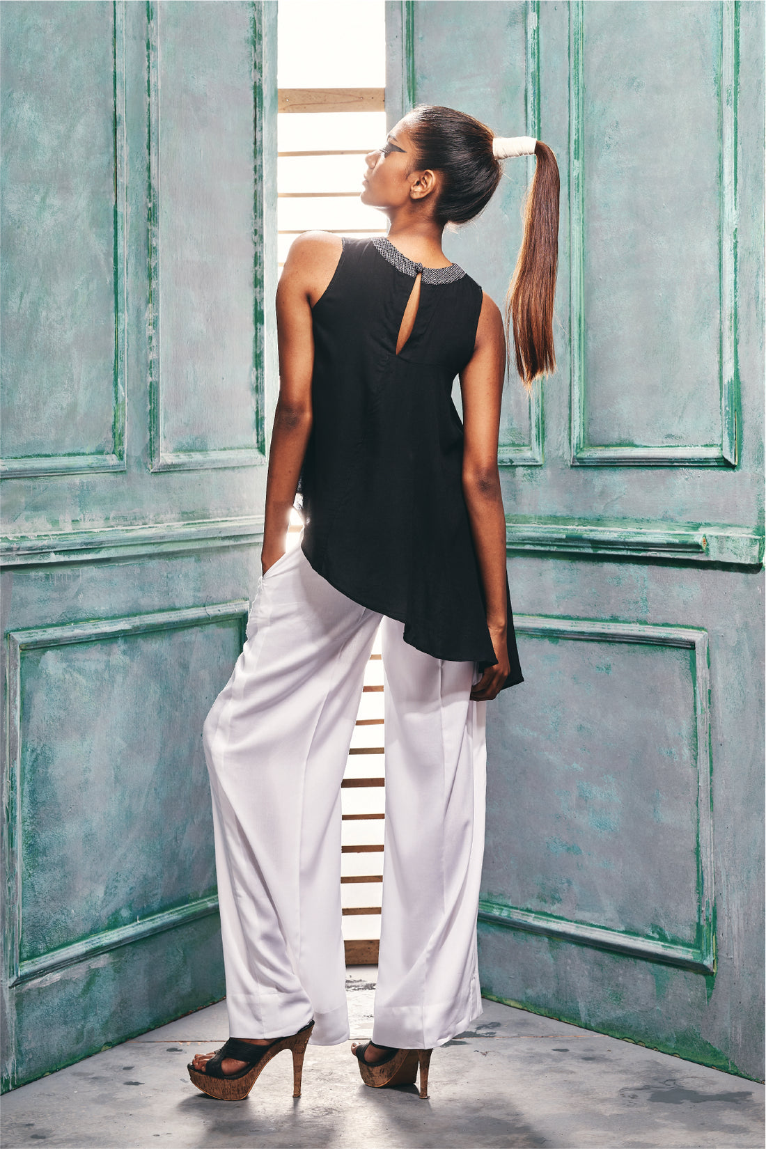 Sleeveless Top With Asymmetric Ruffle Hem