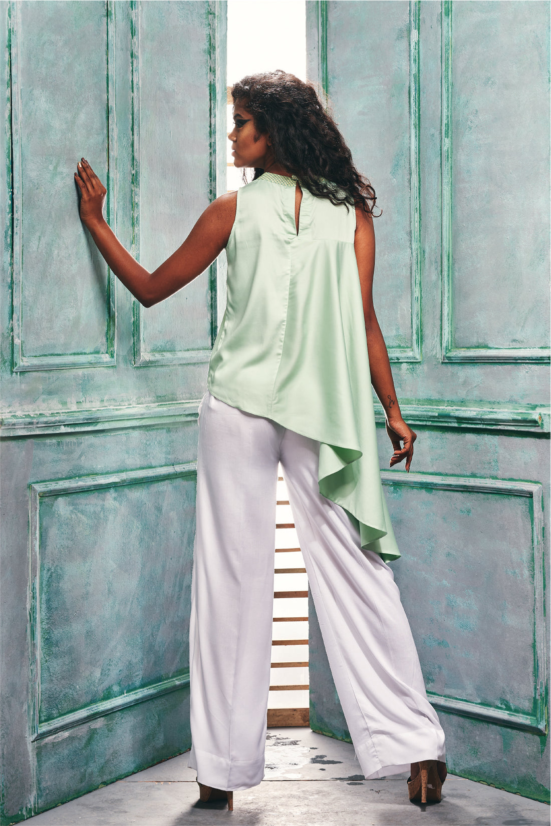 Sleeveless Top With Asymmetric Ruffle Hem