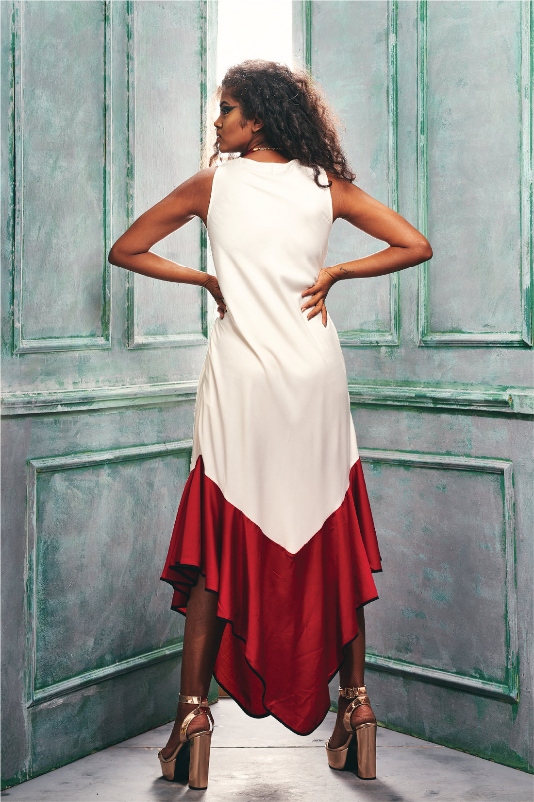 Front view of the sleeveless Tunic Dress With an Asymmetric Hem.