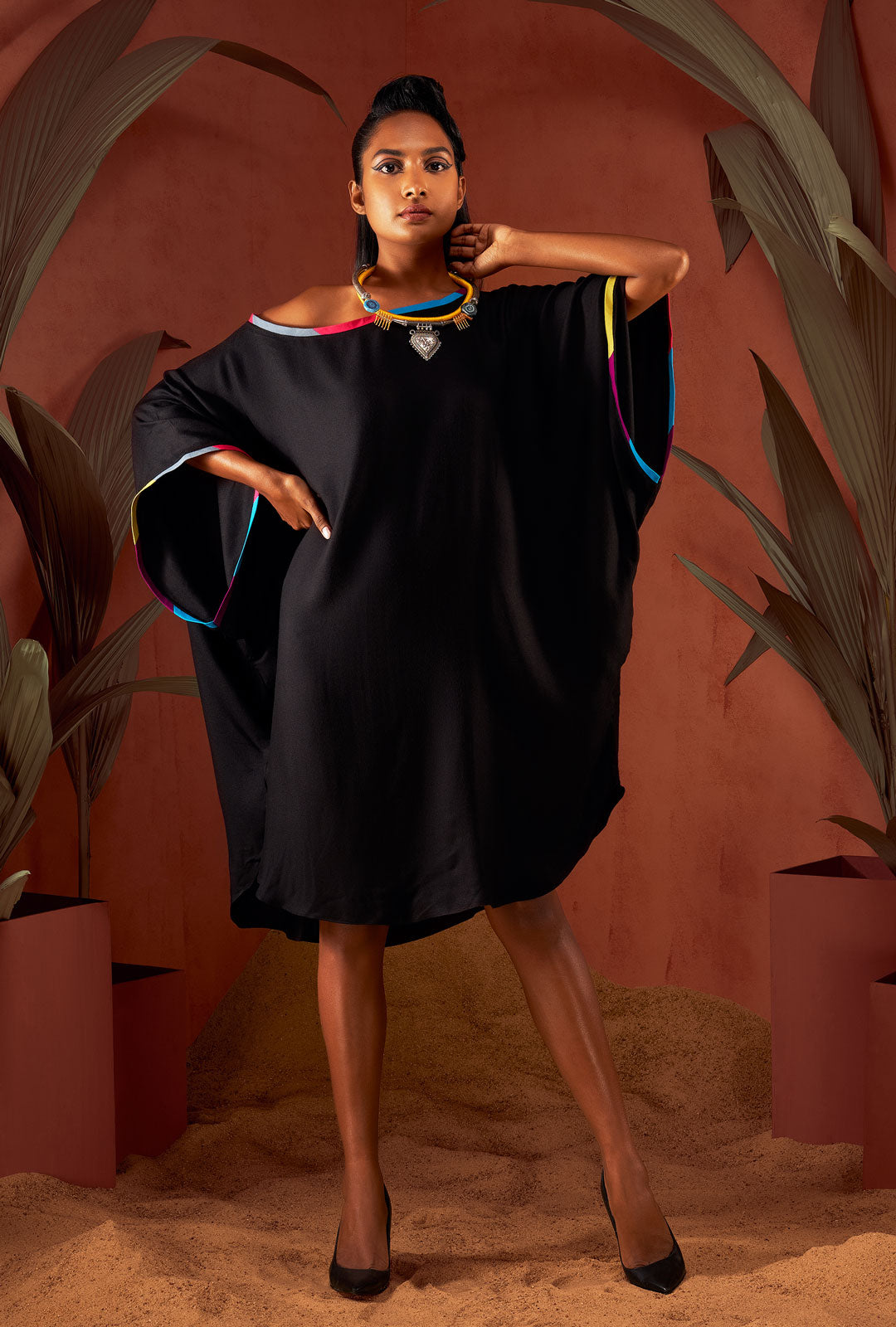 Front view of a black color solid tunic.