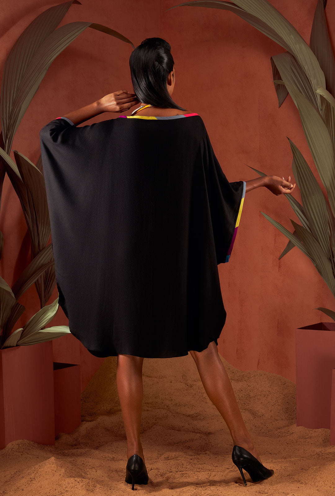 Front view of a black color solid tunic.