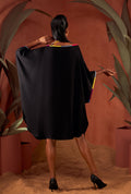Back view of a black color solid tunic.