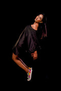 Sie view of a black color solid tunic.