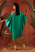 Side view of a green color solid tunic.