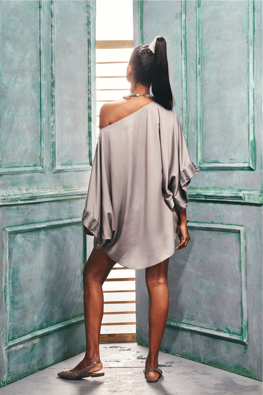 Front view of the oversized top with cross pintuck.