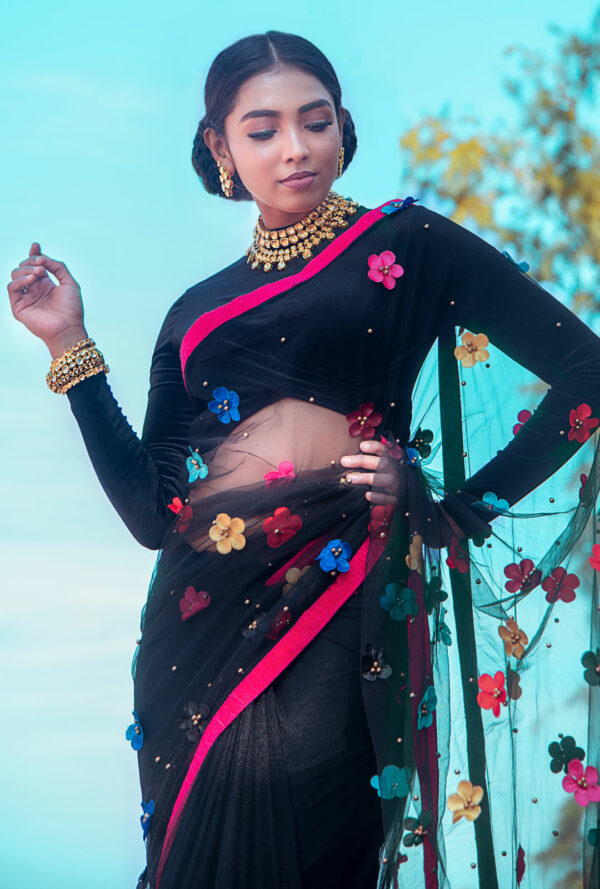 A model wearing a Black Tulle Ruffle Half And Half Saree.