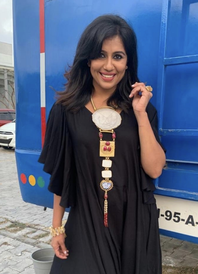 TV celebrity Ranjini Haridas in a black asymmetrical gown.