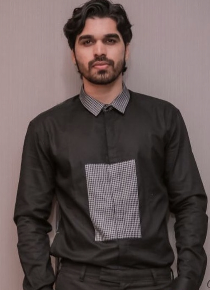 Actor Shiyas Kareem in a check blocked shirt.