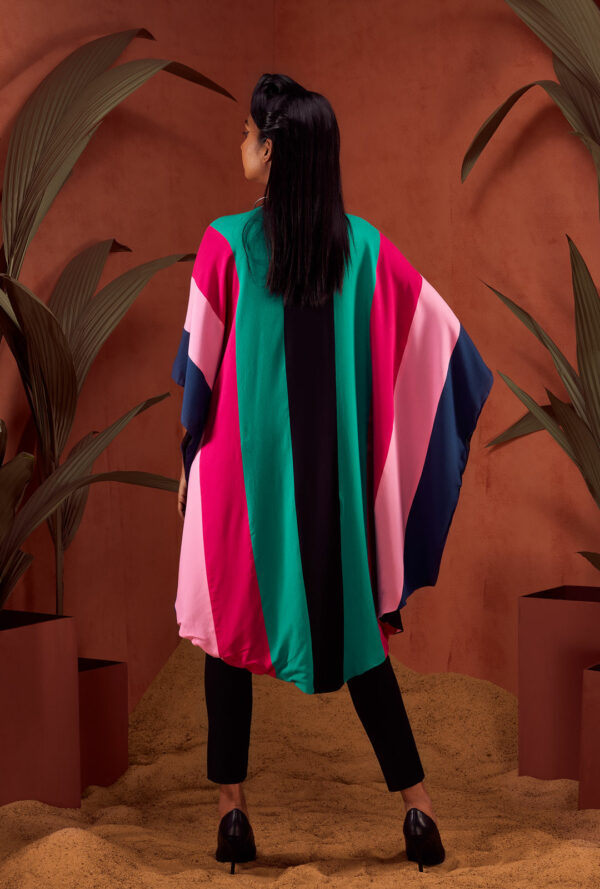 Back view of a color-blocked poncho.